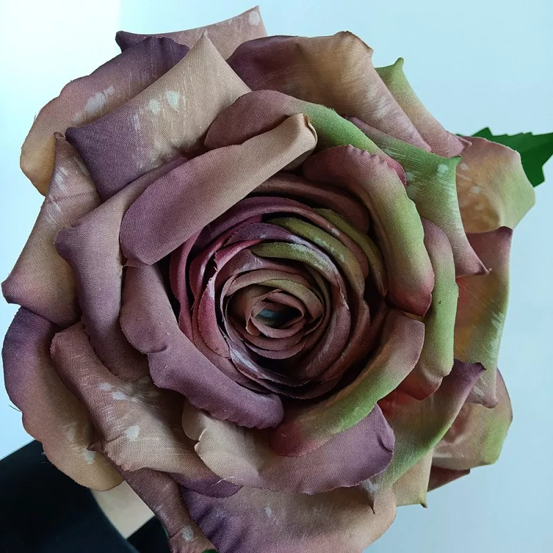 classic artificial rose flowers in white ceramic vase