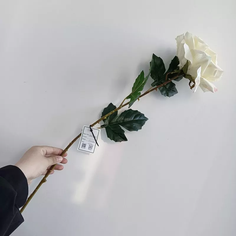 artificial dusty rose flowers in vintage vase display